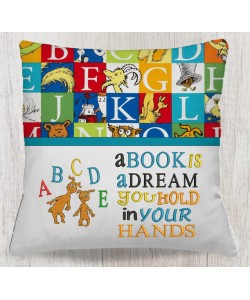 Ichabod and Izzy with a book is a dream reading pillow embroidery designs